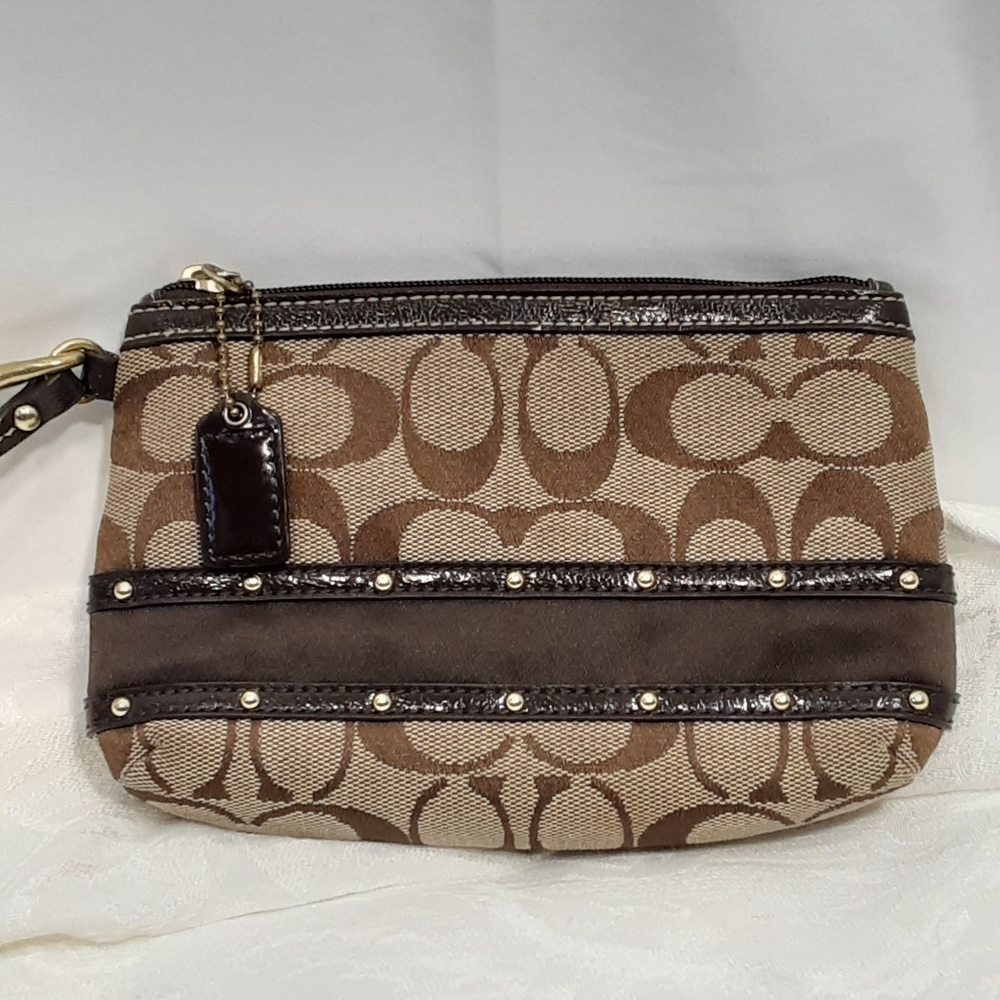 Coach Signature Canvas Jacquared Monogram C Wristlet in Brown/Tan.